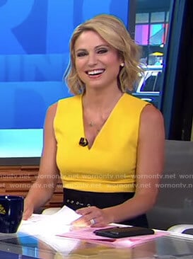 Amy's yellow v-neck top and black belted skirt on Good Morning America