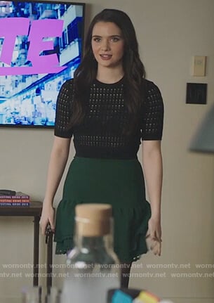 Jane's black short sleeve sweater and green eyelet skirt on The Bold Type