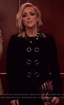 Jacqueline's black floral collared coat and printed clutch bag on Unbreakable Kimmy Schmidt