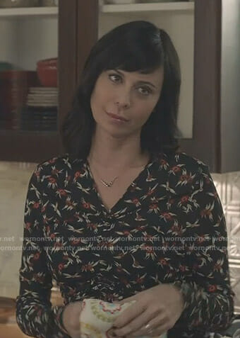 Cassie's black floral ruched front top on Good Witch