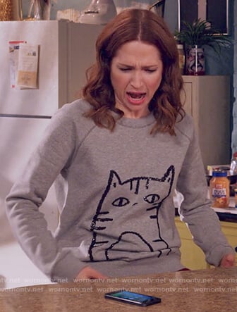 Kimmy's gray sequin cat sweatshirt on Unbreakable Kimmy Schmidt