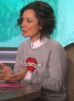 Sara's gray heart print sweater on The Talk