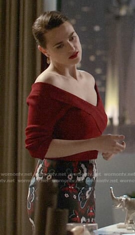 Lena's red off-shoulder top and printed pencil skirt on Supergirl