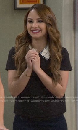 Sofia's black top with floral collar on Young and Hungry