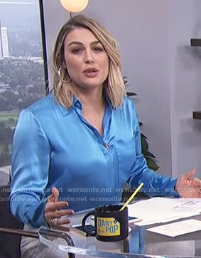 Carissa's blue shirt with lace up cuffs on E! News Daily Pop