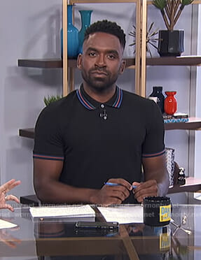 Justin's black striped polo shirt on E! News Daily Pop