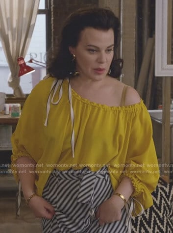 Maggie's yellow drawstring blouse on Younger