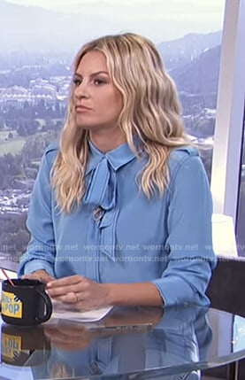 Morgan's blue tie neck blouse on E! News Daily Pop