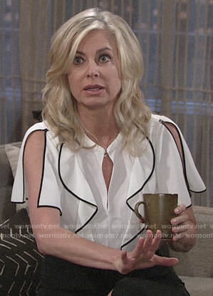Ashley's white ruffled blouse with black trim on The Young and the Restless
