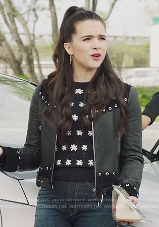 Jane's black floral sweater and grommet embellished moto jacket on The Bold Type