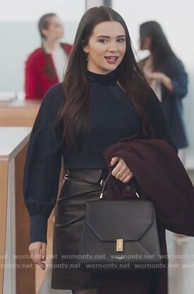 Jane's navy cutout top and black leather skirt on The Bold Type