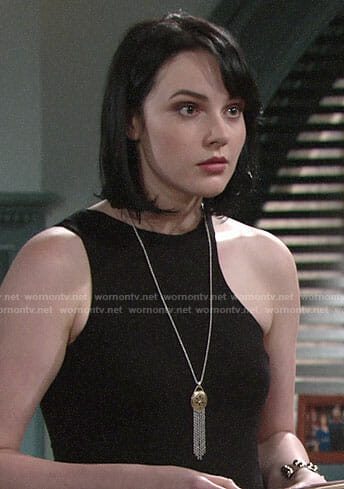 Tessa's black asymmetric top and fringed pendant necklace on The Young and the Restless