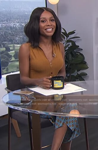 Zuri's orange ribbed top and printed trousers on E! News Daily Pop