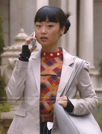 Monica's mixed print mock neck top on Take Two