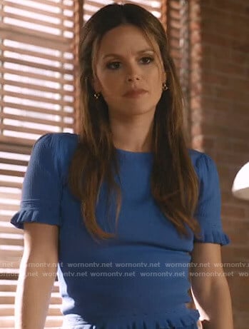 Sam's blue ruffled short sleeve top on Take Two