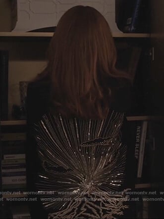 Kitty's black embroidered cape coat on Dietland