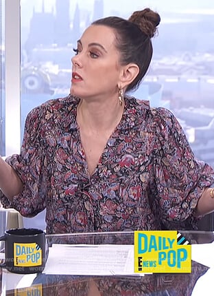 Melanie's black floral print v-neck blouse on E! News Daily Pop