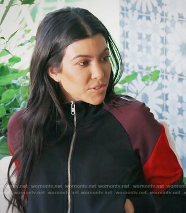 Kourtney's black striped track jacket on Keeping Up with the Kardashians