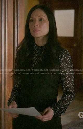 Joan's black star print blouse on Elementary