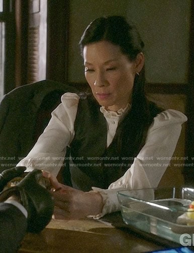 Joan's white ruffled trim blouse on Elementary