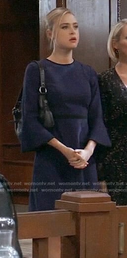 Kiki's navy bell-sleeve dress with black trim on General Hospital