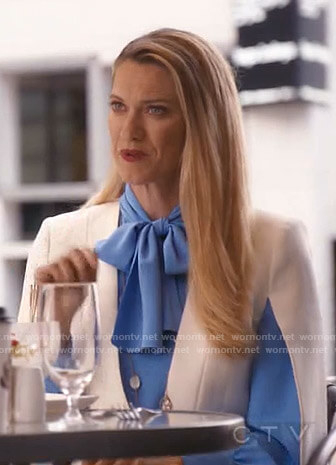 Sydney's blue tie neck blouse and cape jacket on Take Two