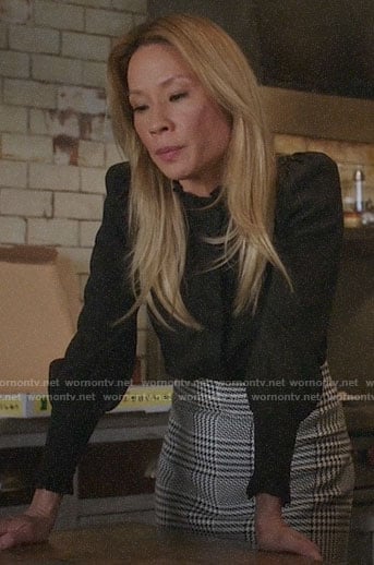 Joan's black ruffled neck blouse on Elementary