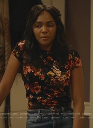 Jennifer's black floral top and distressed jeans on Black Lightning