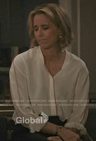 Elizabeth's white blouse with red trim on Madam Secretary