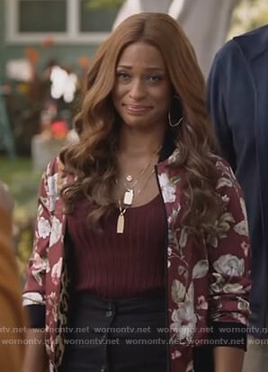 Poppy's floral bomber jacket and black midi skirt on Single Parents
