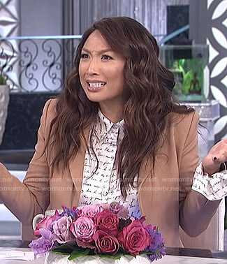 Jeannie's white script print blouse and fringed pants on The Real