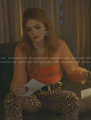 Kirby's orange sweater and leopard pants on Dynasty