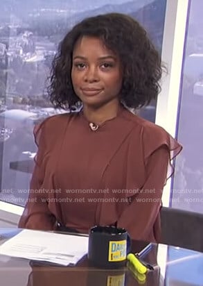 Zuri's brown ruffled blouse on E! News Daily Pop