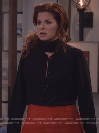 Grace's black tie neck blouse and red suede skirt on Will and Grace