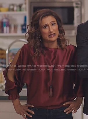 Emet's red satin split-sleeve top on I Feel Bad
