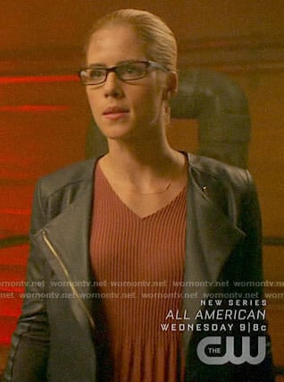 Felicity's pink pleated top and blue leather jacket on Arrow