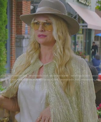 Alexis's gold fringed cape and wool hat on Dynasty