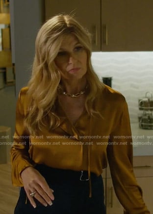 Debra's orange tie neck silk blouse on Dirty John