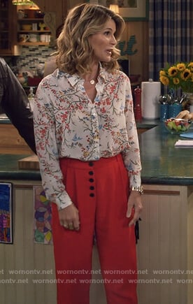 Rebecca's white floral print blouse and red cropped pants on Fuller House