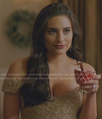 Cristal's gold off-shoulder lace dress on Dynasty