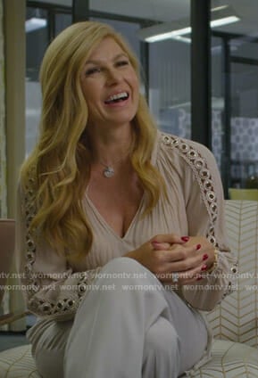 Debra's pink grommet embellished blouse on Dirty John