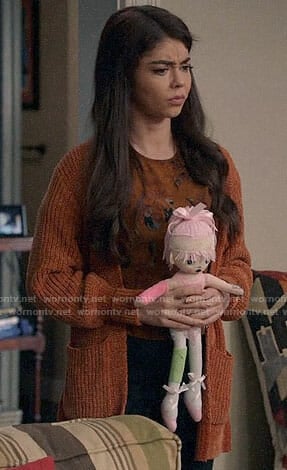 Haley's orange cardigan on Modern Family