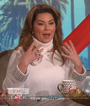 Shania Twain's white embellished cuffs cutout sweater on The Talk