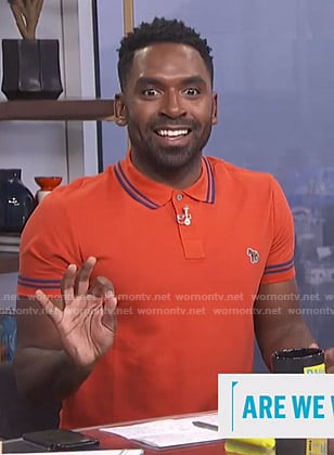 Justin's orange polo shirt with zebra patch on E! News Daily Pop