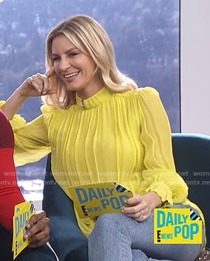Morgan's yellow pleated mock neck blouse on E! News Daily Pop