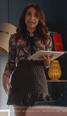 Ana's black star print mini skirt on Grown-ish