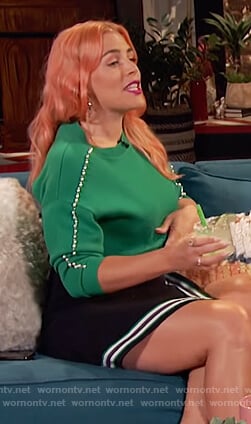 Busy's green embellished sleeve sweater and stripe trim mini skirt on Busy Tonight