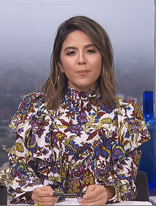 Erin's white floral ruffled blouse on E! News Daily Pop