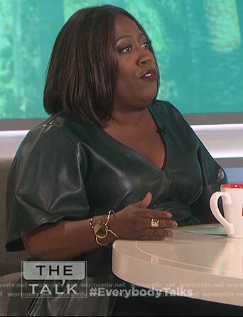 Sheryl's green leather v-neck top on The Talk