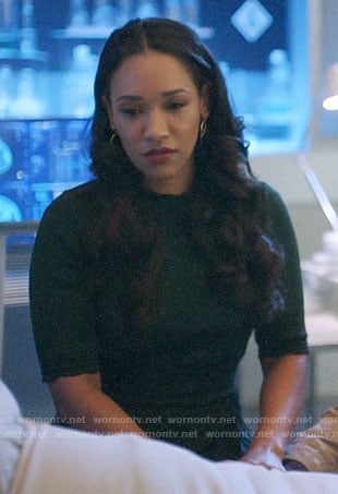 Iris's dark green pleated dress on The Flash